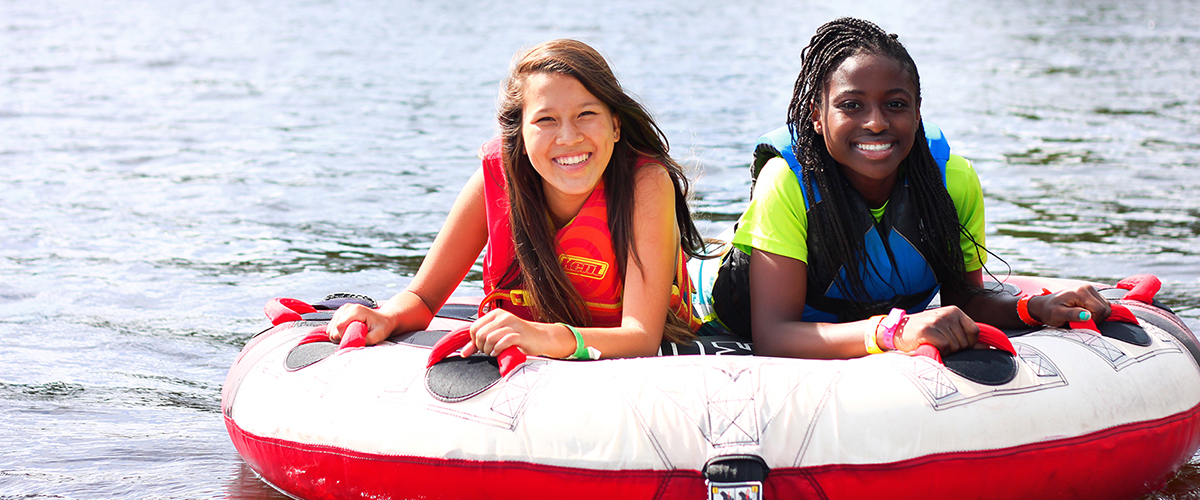 girls tubing at overnight camp