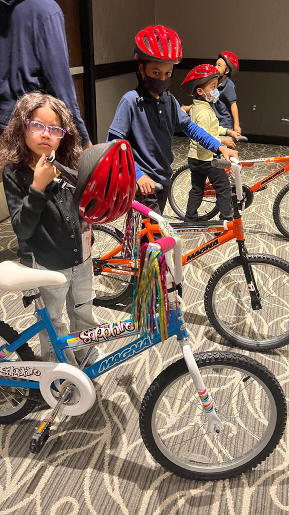 kids with bikes from 2022 adopt-a-family